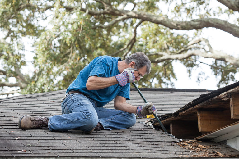 roofer repairing leaky roof